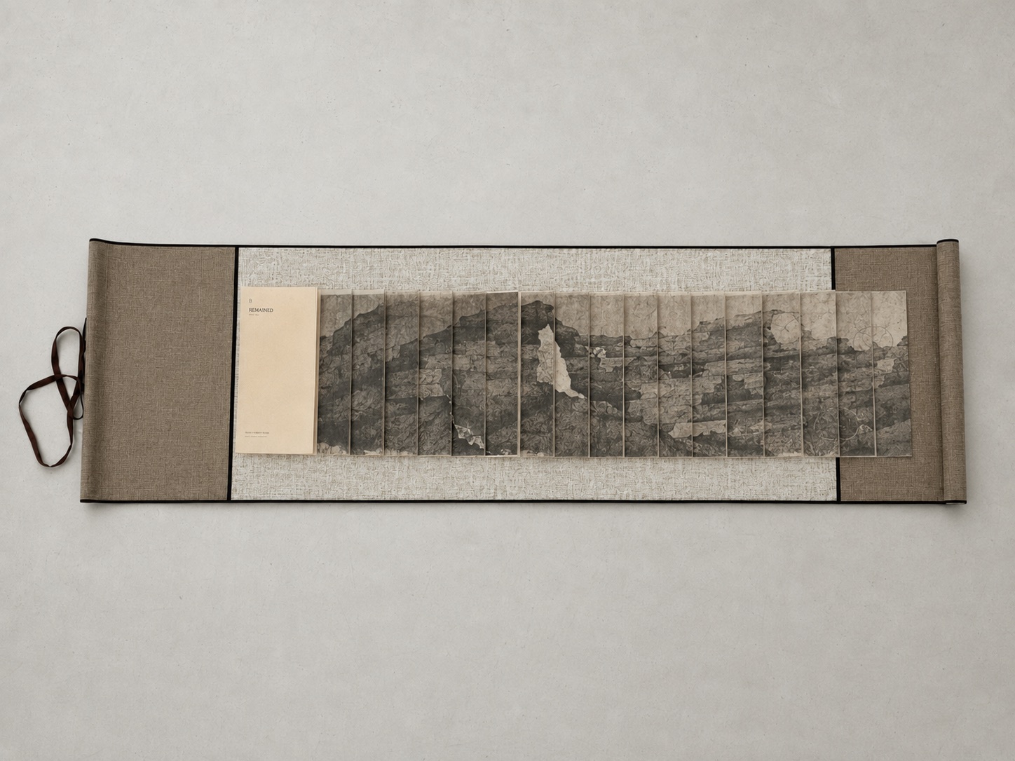 AI-assisted visualisation of B Remained as a dragon-scale scroll book.
