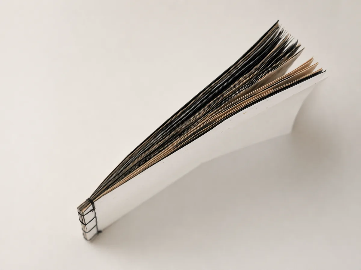 Skin of Writing book showing its thickness and page edges.