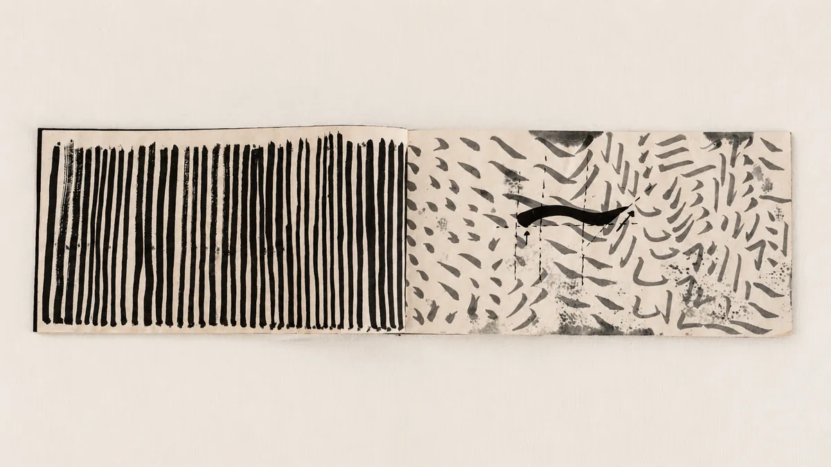 Interior spread showing control marks and writing traces.