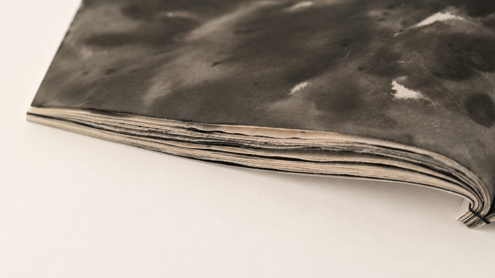 Close detail of layered pages and binding.