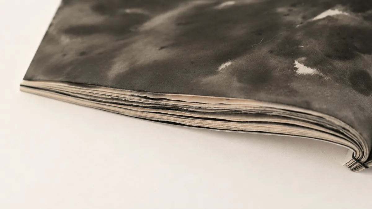 Close detail of layered pages and binding.
