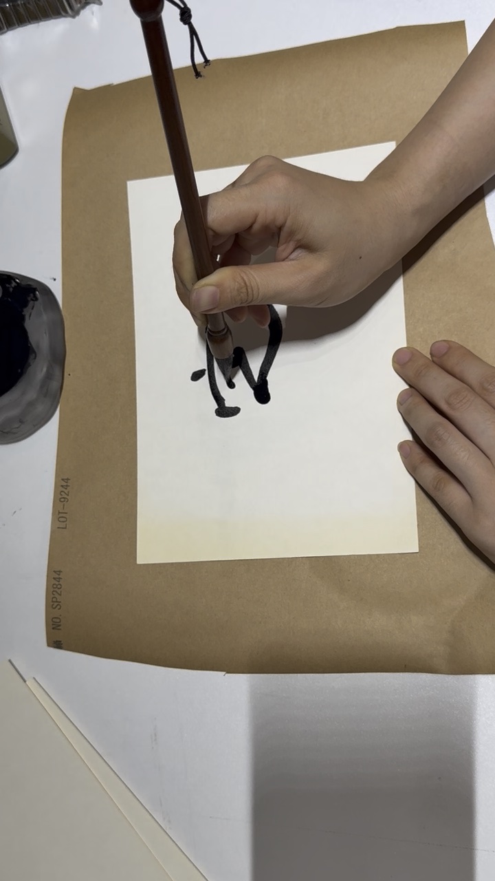 Take C at 28.01 seconds, as the brush returns to the written area.