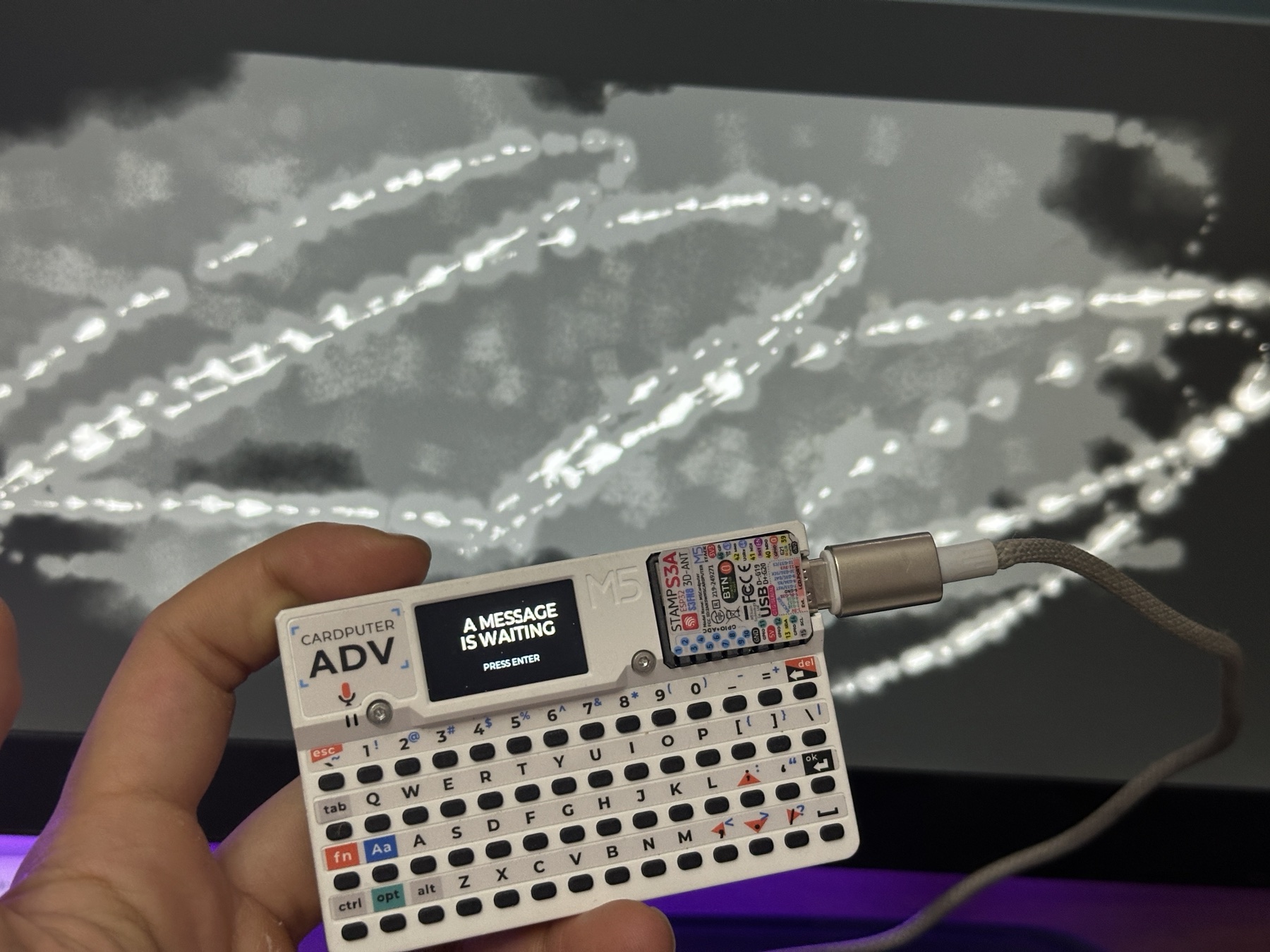 M5Stack Cardputer being tested beside the live Web Field