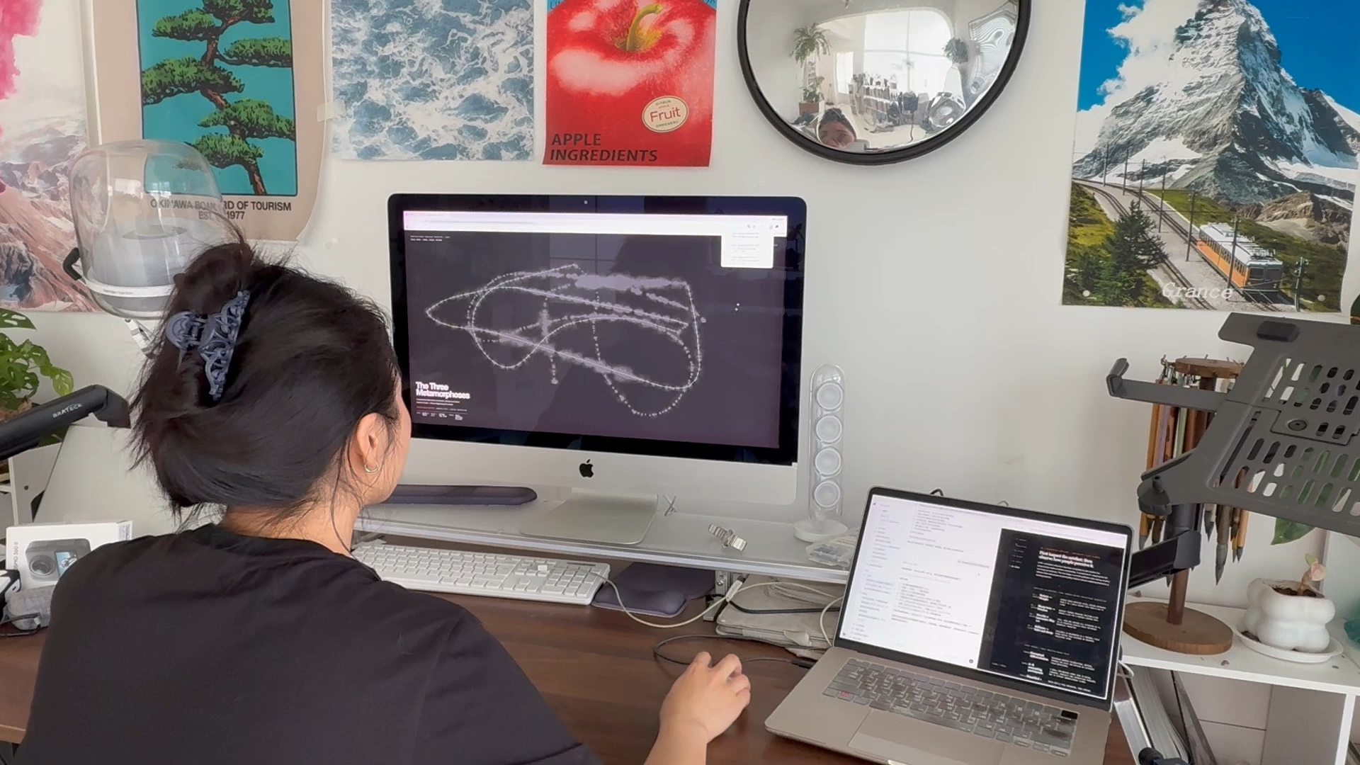 Author seated between a large monitor and laptop while the responsive field is running